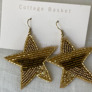 Gold star dangle earrings