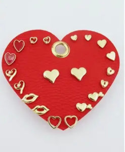 Set of 10 Gold Heart Earrings on Red Leather Heart