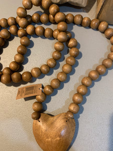 Brown wooden prayer beads with heart
