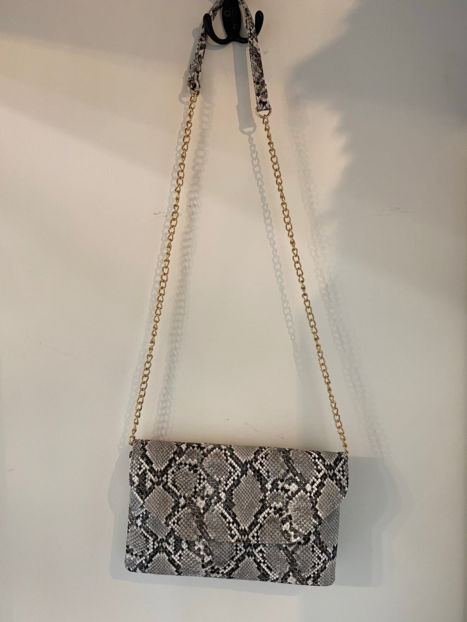 Snakeskin purse with gold chain