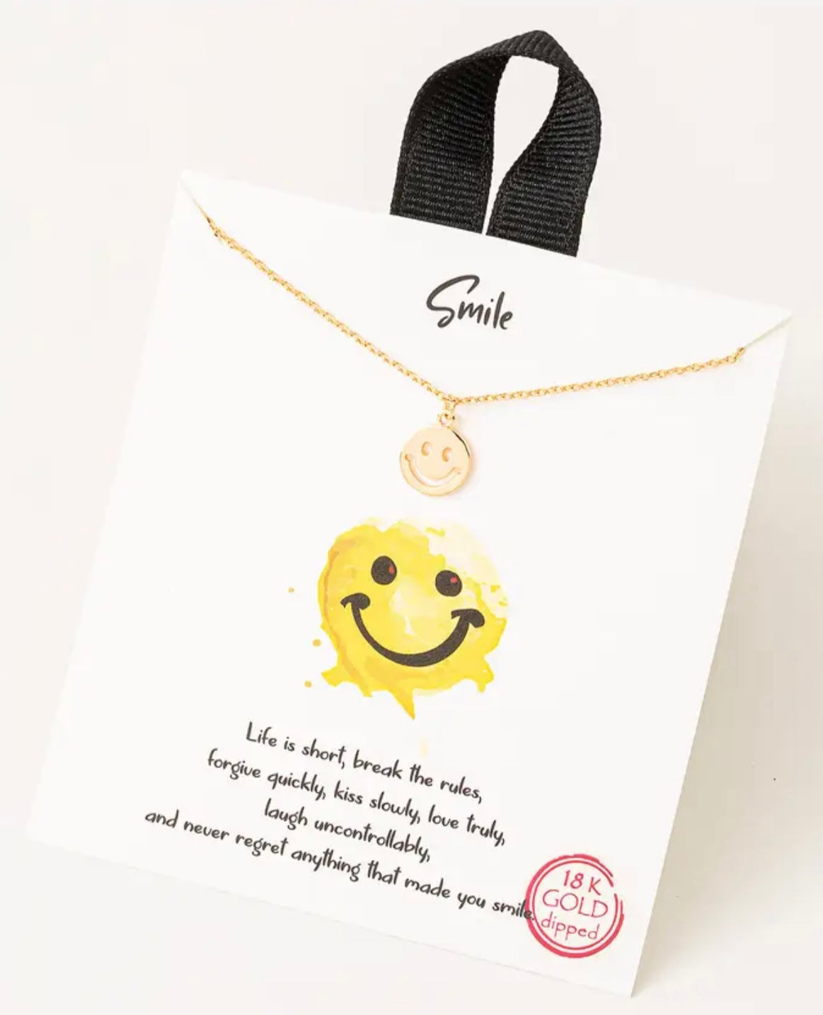Gold smiley face necklace